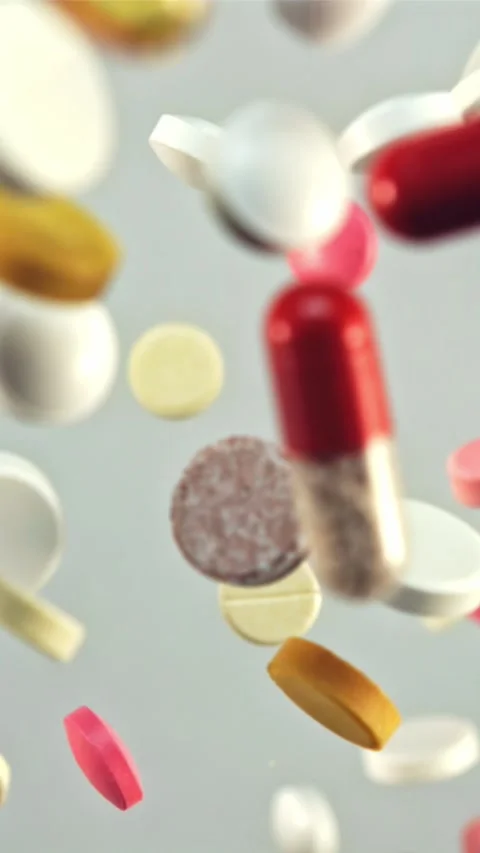 A bunch of different medical pills in flight. Filmed is slow motion 1000 fps Stock Footage 335293030