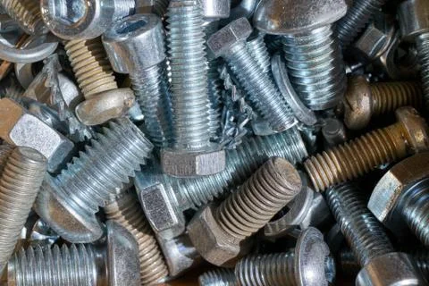A bunch of different threaded bolts with different heads. Stock Photos