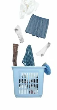 A bunch of dirty laundry clothes fly out of the laundry basket. cutout isolat Stock Photos