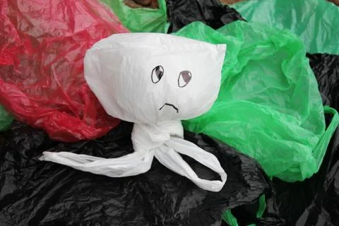 A bunch of disposable, multi-colored plastic bags polluting the environment . Foto stock