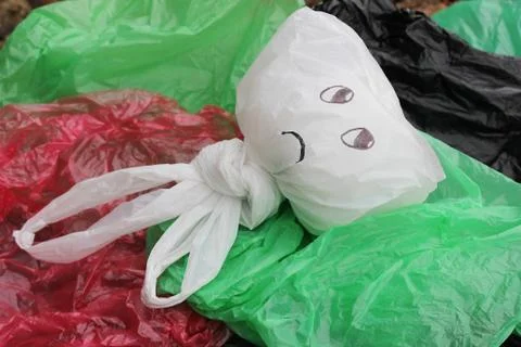 A bunch of disposable, multi-colored plastic bags polluting the environment . Foto stock