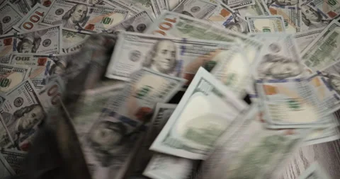 Bunch of dollar banknotes blows off table. Paper money blown away table by wind Vídeos de archivo 252723718