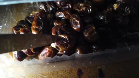 A bunch of dried dates in a plastic container, dried dates for the Hajj Vídeos de archivo 197369198