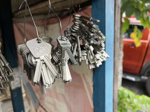 Bunch of duplicate keys with key chain in a locksmith's shop Stock Photos