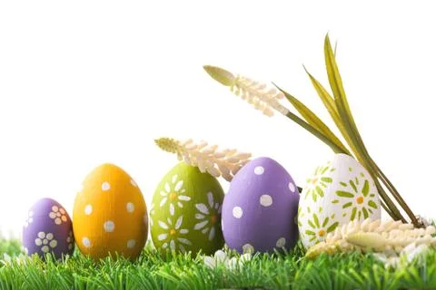 Bunch of easter eggs in pastel colors on grass Stock Photos