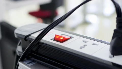 Bunch of electrical plug plugged into the socket on the extension cord Stock-Footage 124649819