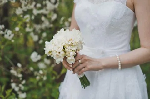 Bunch of flowers in hands  Stock Photos