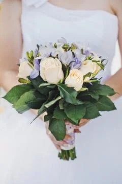 Bunch of flowers in hands  Stock Photos