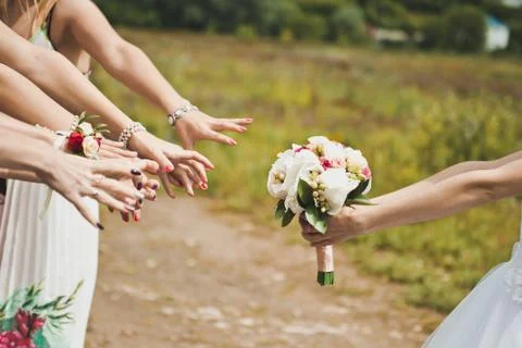 Bunch of flowers in hands  Stock Photos