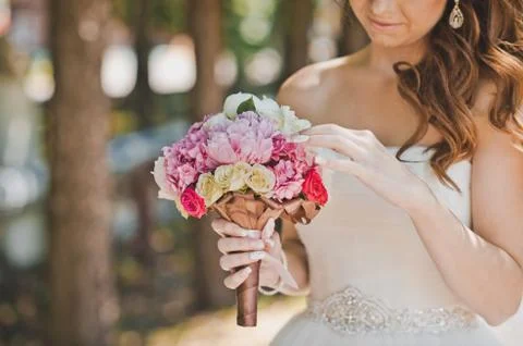 Bunch of flowers in hands  Stock Photos