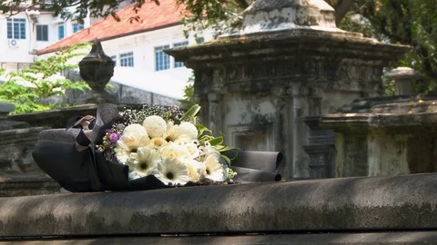 Bunch of Flowers on Tomb Stock Footage 80982668