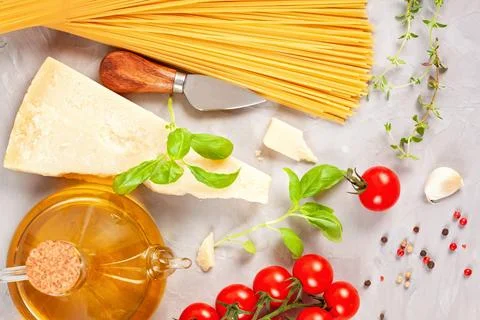 Bunch of fresh basil, tomatoes, parmesan cheese, garlic and olive oil - tradi Stock Photos