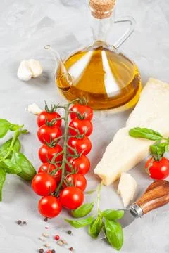 Bunch of fresh basil, tomatoes, parmesan cheese, garlic and olive oil - tradi Stock Photos
