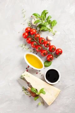 Bunch of fresh basil, tomatoes, parmesan cheese, garlic and olive oil - tradi Stock Photos