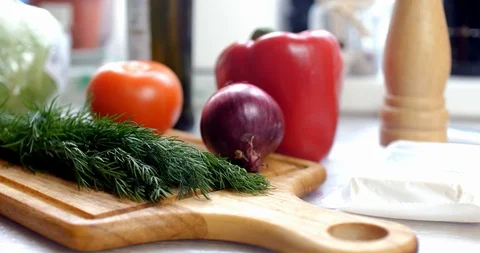 Bunch of fresh organic dill on a rustic wooden plate Stock Footage 87252511
