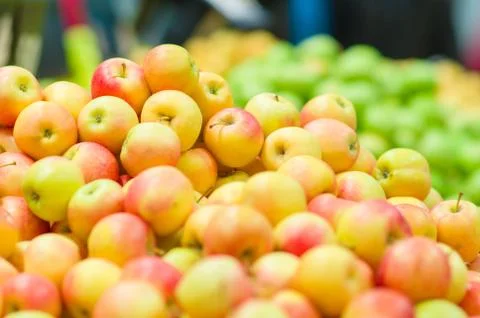 Bunch of fresh red apples in boxes in supermarket Stock Photos