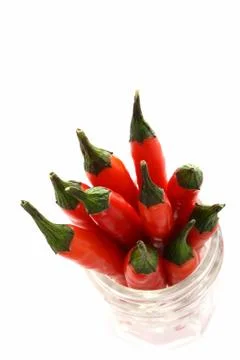 Bunch of fresh red hot chilli chilies pepper in a glass jar Stock Photos