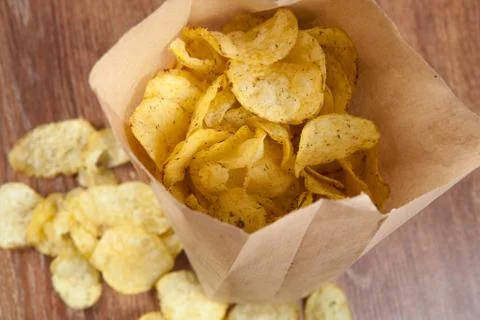 Bunch of fried potato chips in the package Stock Photos