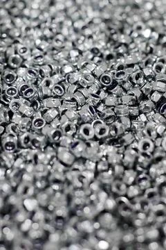 Bunch of galvanized hexagon locknuts for bolts, fasten multiple parts togethe Stock Photos