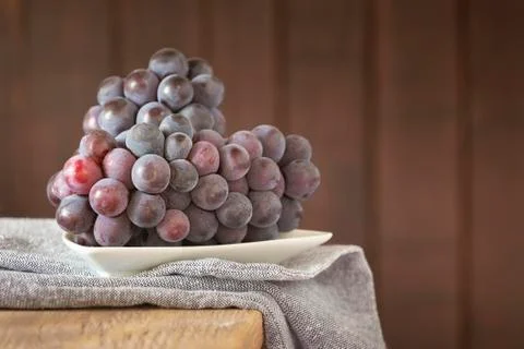 Bunch of grapes for red wine on the table Stock Photos