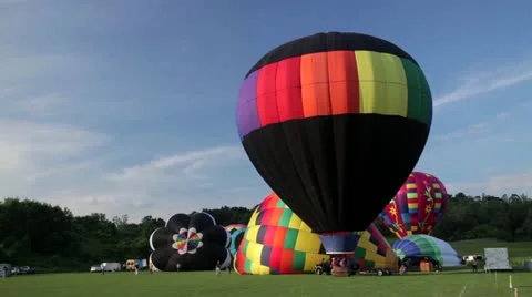 A bunch of hot air balloons preparing for flight Stock Footage 20484056