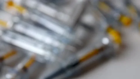 Bunch of injection syringes as vaccinations doses and booster vaccination Stock Footage 204479265