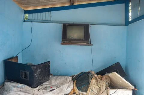A bunch of junk in a camping post with an old tv that can still be used, In.. Stock Photos