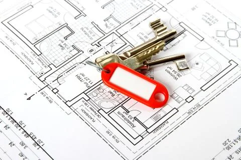 Bunch of keys with red keychains at building drawing Stock Photos