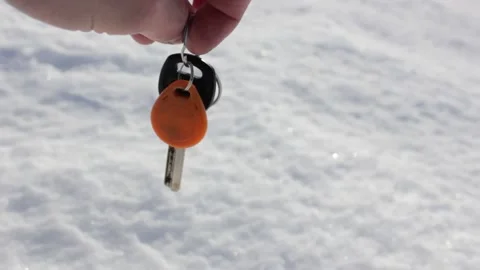 The bunch of keys in the snow. Lost keys. Find the keys to the apartment house. Stock Footage 170434671