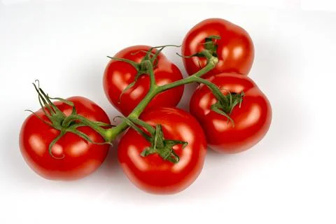 A bunch of large tomatoes on a white background Stock Photos
