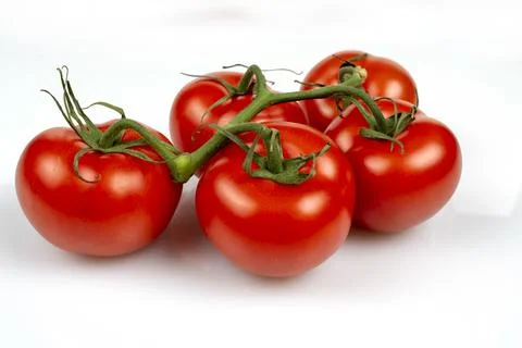 A bunch of large tomatoes on a white background Foto stock