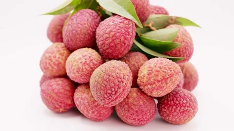 Bunch Lychee Rotating On White Background. Stockbeeldmateriaal 196048964