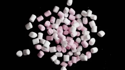 A bunch of marshmallows fly up to the chamber. Stock Footage 189319534