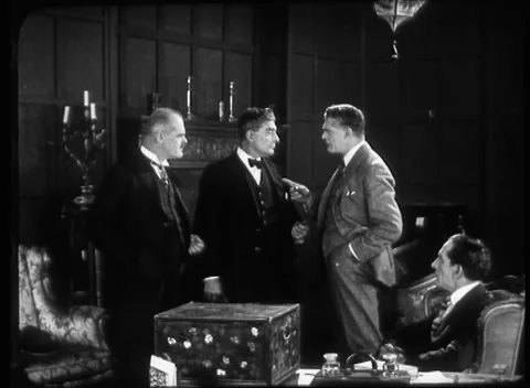 Bunch of men standing and talking in New Louvre hotel, United Kingdom, 1923 Video stock 172219808
