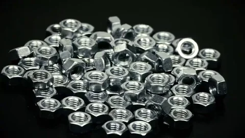 Bunch of metal nuts rotating Stock Footage 69109273