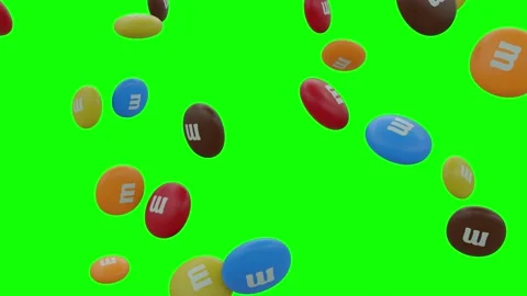 Bunch of MMs Candy Candies Falling On A Screen With Alpha Channel Stock Footage 237903380