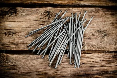 A bunch of nails on the table. Stock Photos