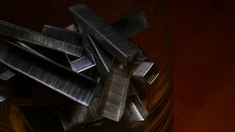 A bunch of office staples. Some metallic paperclips Stock Footage 152104783
