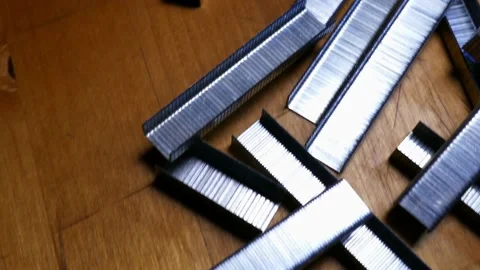 A bunch of office staples. Some metallic paperclips Stock Footage 152104795