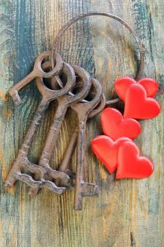 Bunch of old keys and red hearts. Stock Photos