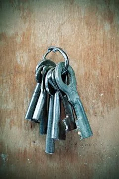 Bunch of old keys on the wall. Stock Photos