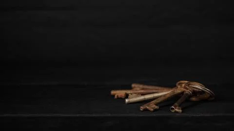 Bunch of old metal keys on a table, copy space Fotos Stock