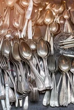 Bunch of old silver ware on a flea market Stock Photos