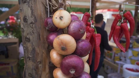 A bunch of onions on the post Stock Footage 95765842
