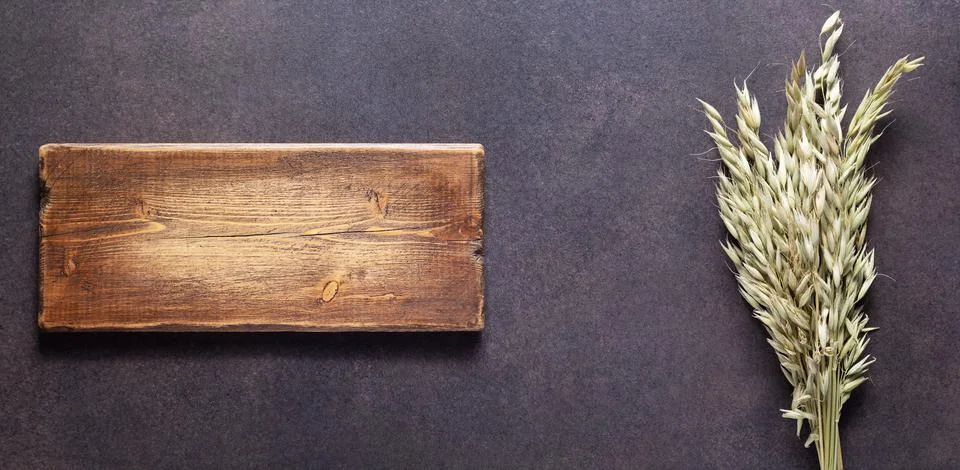 Bunch or bundle of oat at table. Natural food concept Stock Photos