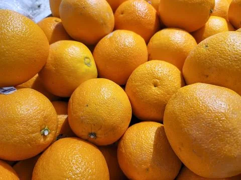 A bunch of oranges are piled up Stock Photos