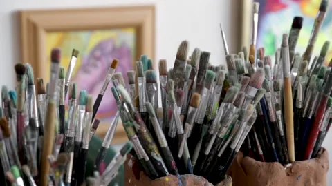 A bunch of paintbrushes in an art studio Stock Footage 154313768