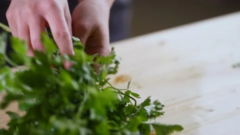 A bunch of parsley on a cutting board. Stock Footage 189216085