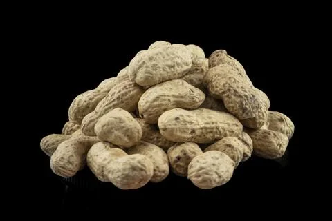 Bunch of peanuts in shells. Peanuts isolated on black Stock Photos