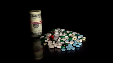 A bunch of pills on a black background Stock Footage 115777148